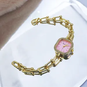 Gold square quartz watch with pink dial and chain strap for women elegant fashion piece