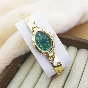 Korean style oval green dial quartz watch for women with gold tone rhinestone bracelet strap.
