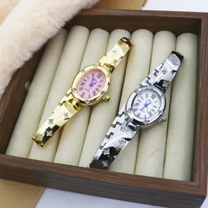 Fashion women's oval quartz watch with roman numerals and rhinestone bracelet strap.