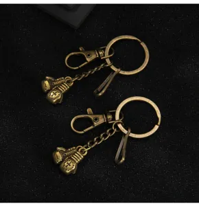 Vintage bronze boxing glove metal keychain pendant with lobster clasp and split ring accessories.