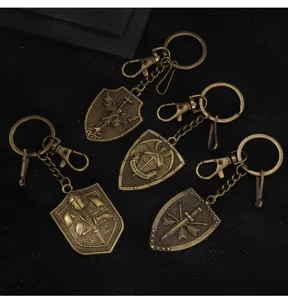 Vintage bronze shield keychains featuring archangel and cross designs, durable metal.