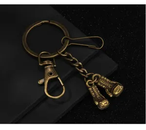 Vintage bronze metal boxing glove keychain close-up detail shot accessory pendant gift