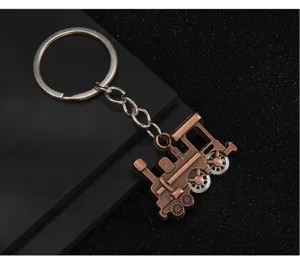 Vintage bronze locomotive keychain with movable wheels, durable metal ring for bags and keys.