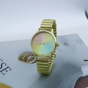 Gold stretch strap quartz watch with colorful gradient rainbow dial for women and students.