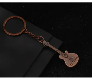 Portachiavi chitarra in metallo rame vintage pendente moda strumento musicale regalo borsa fascino