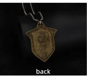 Detailed view of the vintage lion shield pendant necklace showing its textured back design.