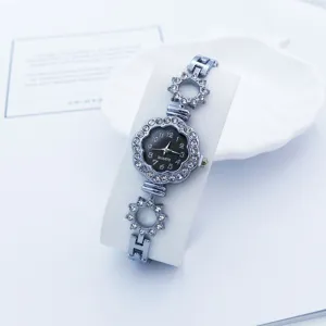 Orologio al quarzo con strass elegante da donna, quadrante floreale dettaglio orologio.