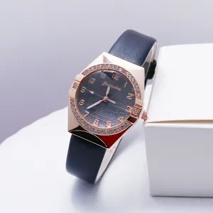 Women quartz watch with rhinestone bezel and leather strap. Elegant fashion timepiece.
