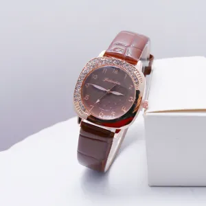 Detailed view of a square women quartz watch featuring a diamond bezel and brown strap.
