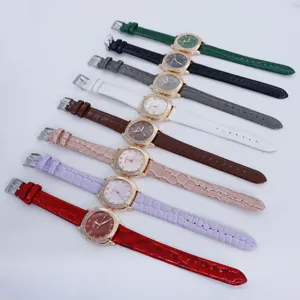 Detailed view of colorful square quartz wristwatches with diamond bezel and leather straps.