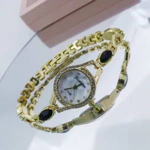 Montre quartz femme dorée élégante avec bracelet strass et cadran perlé tendance