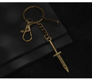 Bronze metal dagger keychain, vintage style game peripheral weapon model bag pendant.