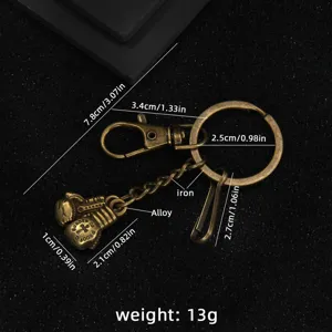 Vintage boxing glove metal keychain antique brass finish cool sport style accessory for keys and bags.