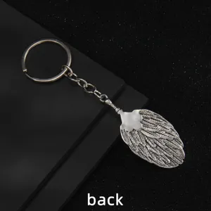 Vintage metal fan keychain pendant for car keys and fashion bags, retro style key ring.