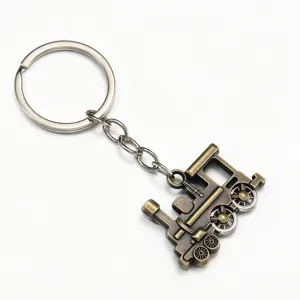 Vintage bronze locomotive keychain with movable wheels, creative retro metal car bag pendant.