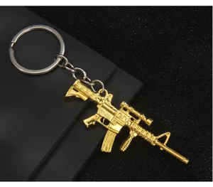 Llavero de modelo de rifle de metal dorado colgante de pistola accesorio de mochila.