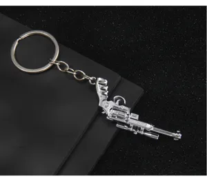 Miniature pistol model keychain, metal gun pendant car key ring for game fans and gifts.