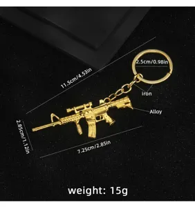 Llavero de metal dorado con forma de rifle y anillo, colgante miniatura detallado para bolsos.