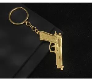 Gold metal pistol keychain military game model car bag pendant gift collectible item.