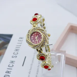 Modische Strass Blumen Quarz Damenuhr, elegante goldene Armbanduhr für Frauen neu.