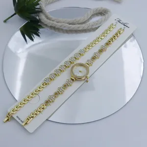 Ensemble montre quartz et bracelet dorés pour femme avec strass, montre mode élégante.