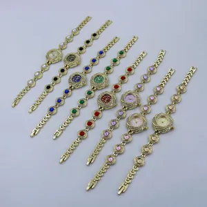 Luxus Damen Quarz Uhr Armband Set mit Strass Blumen Design und bunten Perlen.