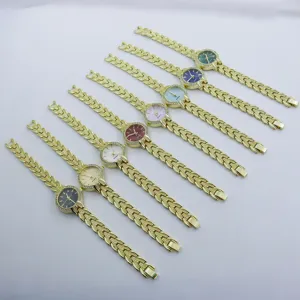 Women quartz watch with gold chain strap and diamond bezel, elegant fashion timepiece.