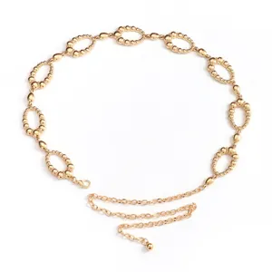 Gold metallic waist chain close-up, featuring textured interlocking round rings and fine chain detail.