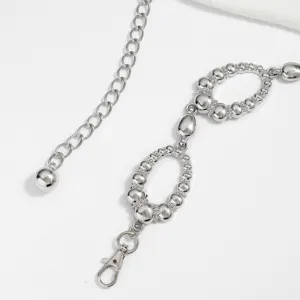 Silver metal waist chain detail, retro beaded ring design, fashion accessory for women.