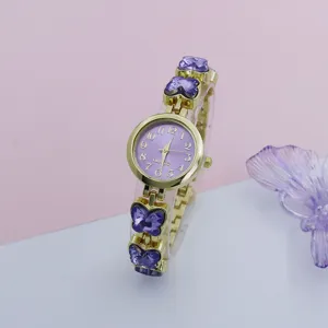 Detailed close-up of the stylish purple crystal butterfly quartz watch, elegant dial.