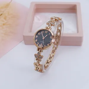 Elegant rose gold clover quartz watch for women with sparkling crystal stones and black dial.