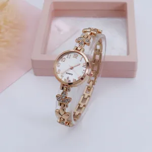 Rose gold clover quartz bracelet watch for women, elegant floral design digital wrist watch.