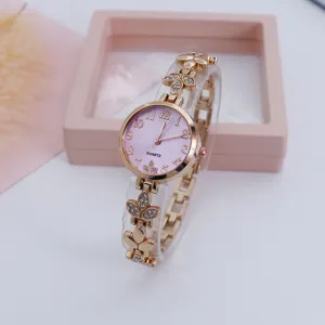 Elegant womens rose gold quartz watch with pink dial and rhinestone clover strap design.