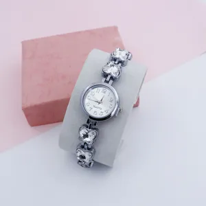 Women fashion quartz watch with crystal butterfly charm bracelet strap and round dial.