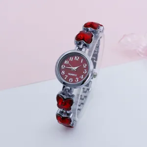 Women quartz watch with red dial and butterfly rhinestone bracelet strap for daily wear.