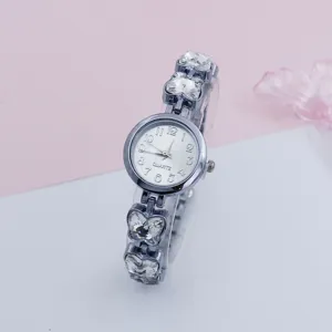 Detail view of women quartz watch, crystal butterfly bracelet strap and clear digital dial.