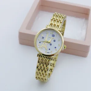 Elegante Damen Quarzarmbanduhr mit goldener Kette, Eiffelturm Zifferblatt und Schneeflocken-Design.
