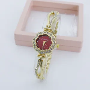 Fashion quartz women watch with rhinestone flower dial and elegant gold bracelet strap.