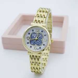 Women gold quartz watch with blue glitter four leaf clover dial and metal chain bracelet