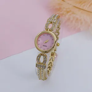 Women fashion quartz watch with sparkling rhinestones, elegant gold metal bracelet band.