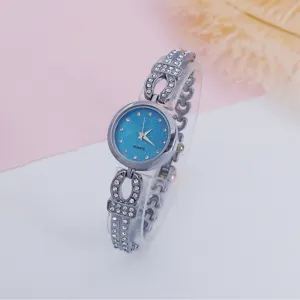 Detailed view of women rhinestone quartz watch with blue starry dial and dazzling bracelet strap.