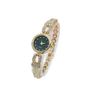 Elegant women's quartz watch featuring a sparkly dark dial and gold-tone rhinestone bracelet.