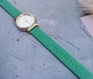 Green silicone strap quartz watch for women, stylish minimalist digital dial casual timepiece.