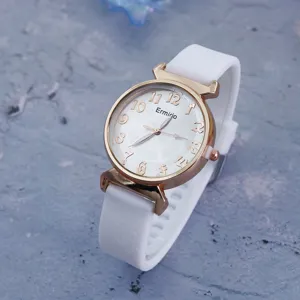 Women white silicone strap quartz watch with rose gold case and digital dial detail shot.
