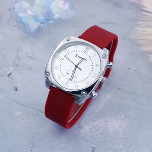 Square quartz watch with red silicone strap and large white dial for women.