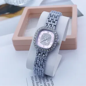 Elegant women quartz watch with square diamond encrusted dial and pink face, stylish wrist.