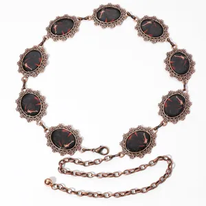 Vintage koperkleurige metalen tailleketting met ovale paard patroon bedels voor dames.