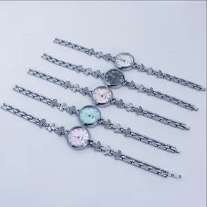 Detailed view of women's quartz bracelet watch with elegant leaf design strap and dial.