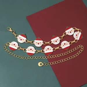 Cadena de cintura dorada con adorables dijes de Papá Noel de esmalte, accesorio festivo.