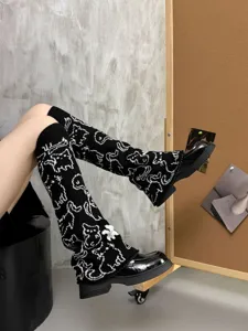 Black and white knitted cat leg warmers, JK style cozy winter stacked socks for women.